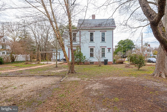 victorian-style house with a chimney