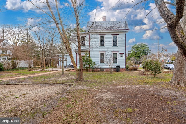 view of front of house with a chimney