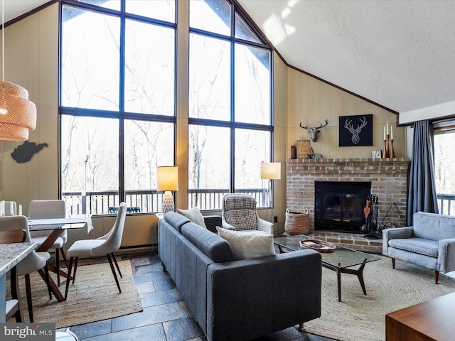 living area with high vaulted ceiling, a textured ceiling, and a fireplace