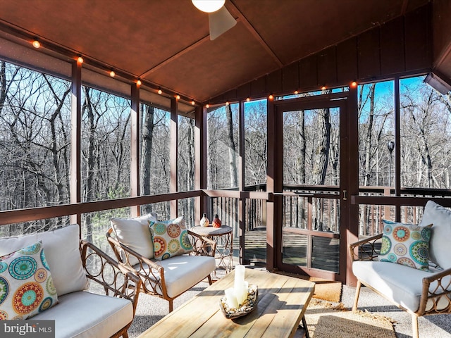 unfurnished sunroom featuring lofted ceiling