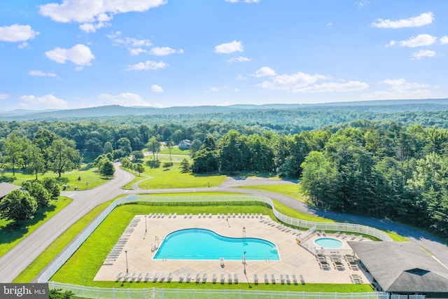 birds eye view of property with a wooded view