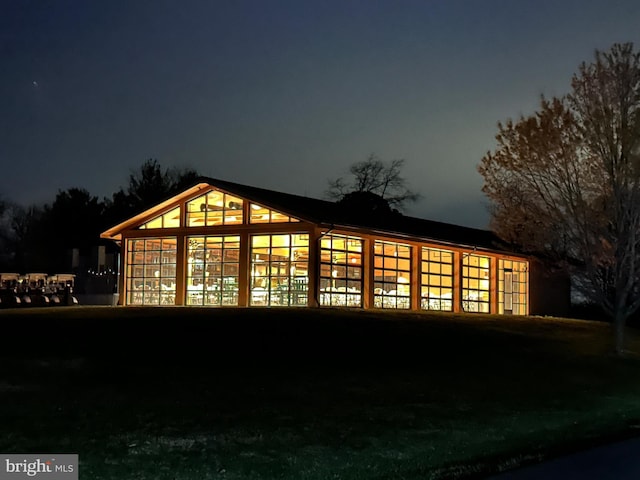 view of property exterior at night