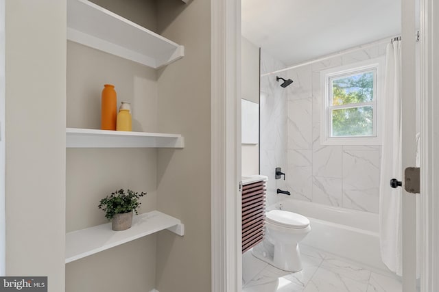 bathroom featuring marble finish floor, toilet, and  shower combination