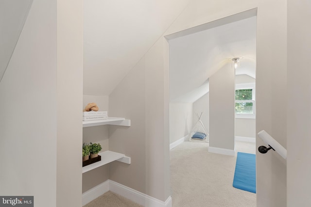 bonus room with lofted ceiling, carpet, and baseboards