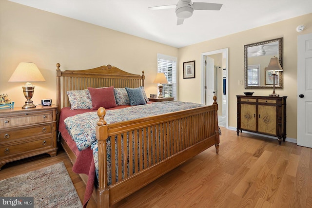 bedroom with ceiling fan, baseboards, and wood finished floors