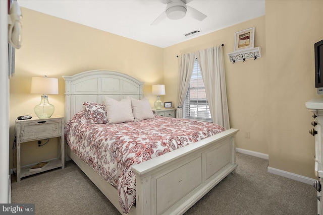 bedroom with ceiling fan, baseboards, visible vents, and light carpet