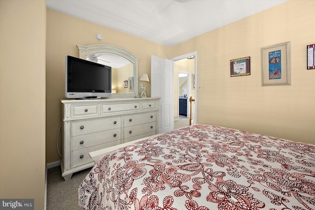 bedroom with dark colored carpet