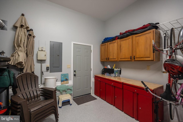 kitchen featuring electric panel and light countertops