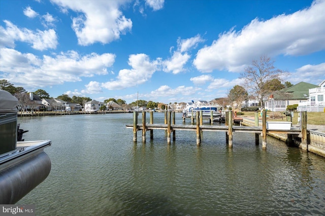 dock area with a water view and a residential view