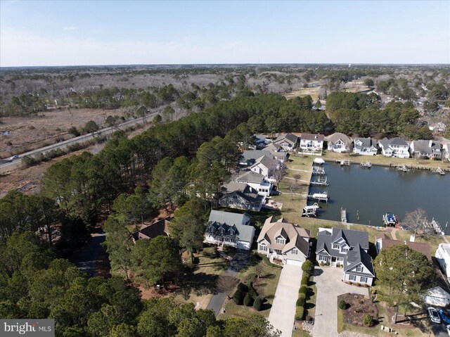 drone / aerial view with a residential view and a water view