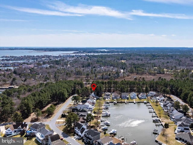 birds eye view of property featuring a residential view and a water view