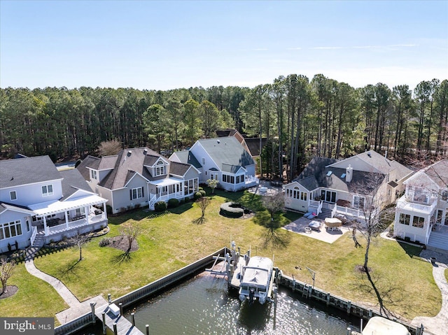 bird's eye view featuring a water view and a wooded view