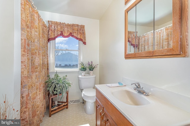 full bathroom with tile patterned floors, toilet, and vanity