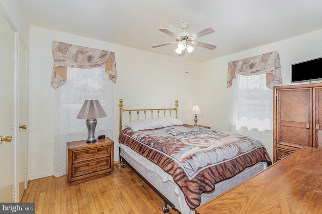 bedroom featuring ceiling fan and hardwood / wood-style floors