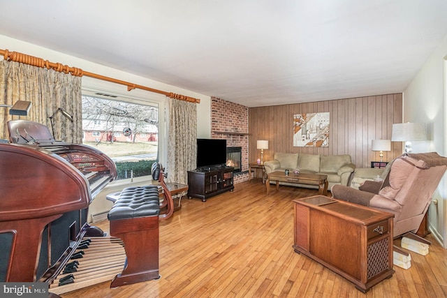 living area featuring hardwood / wood-style flooring and a fireplace