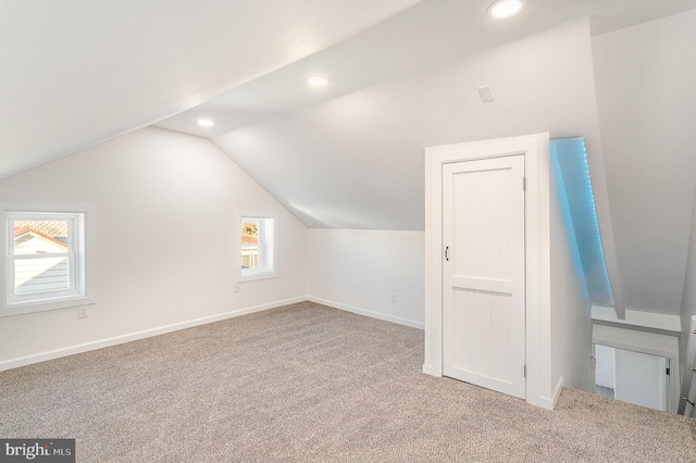 bonus room featuring recessed lighting, baseboards, lofted ceiling, and carpet flooring