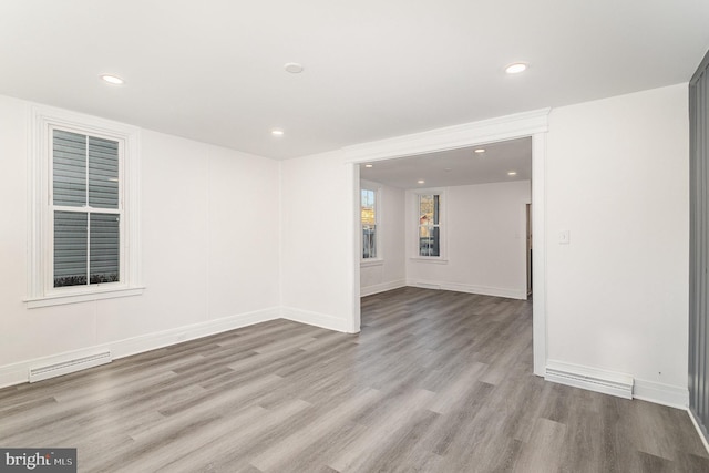 unfurnished room featuring visible vents, recessed lighting, baseboards, and wood finished floors