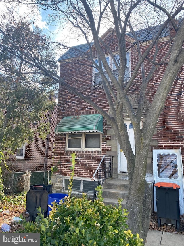 exterior space with brick siding