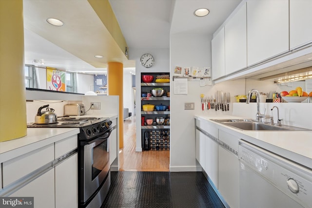 kitchen with range with electric cooktop, dishwasher, white cabinets, and a sink