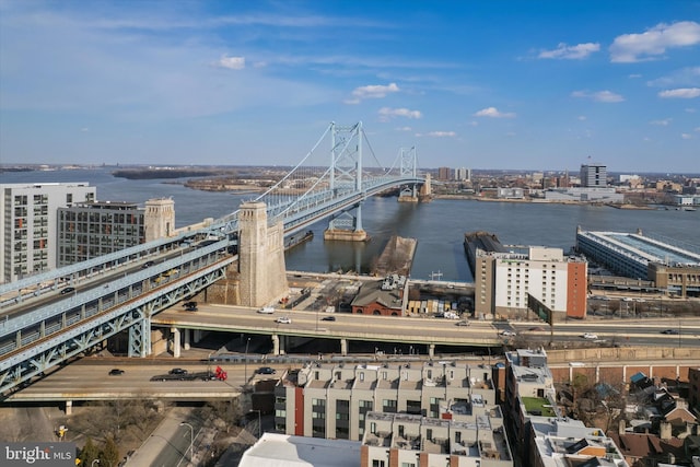 drone / aerial view featuring a view of city and a water view