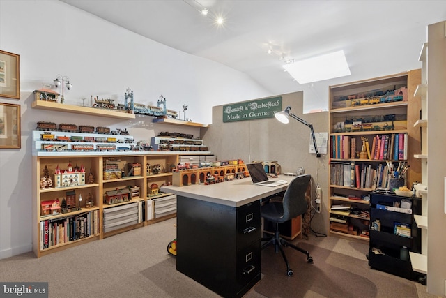 office area featuring lofted ceiling and carpet