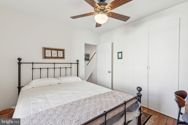 bedroom featuring a ceiling fan and wood finished floors