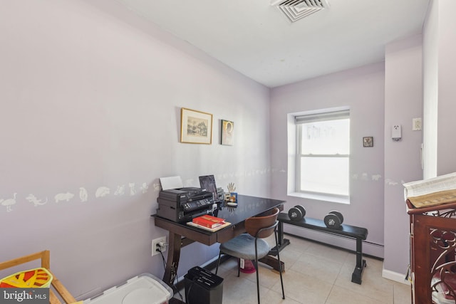 office area featuring light tile patterned flooring, visible vents, baseboard heating, and baseboards