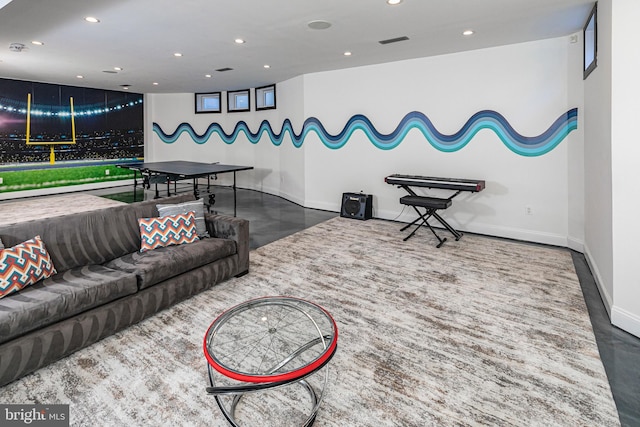 living room with recessed lighting, visible vents, concrete flooring, and baseboards