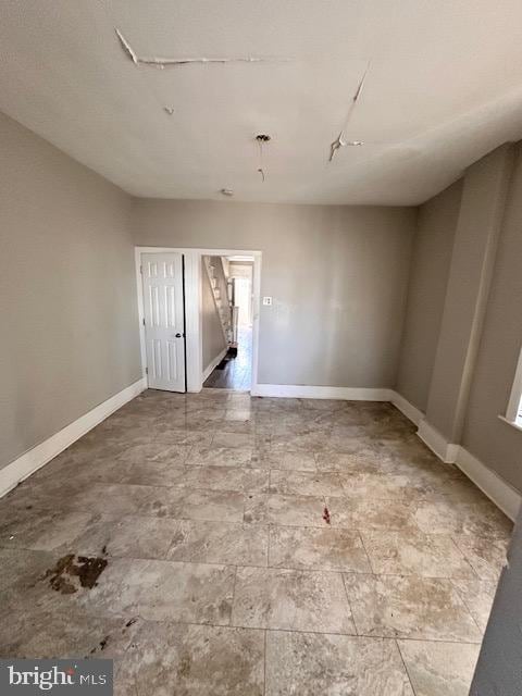 empty room with baseboards