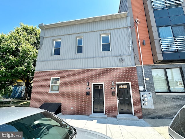 view of front of home featuring brick siding