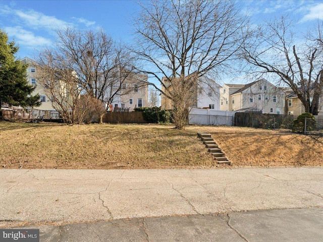 view of yard with fence and a residential view