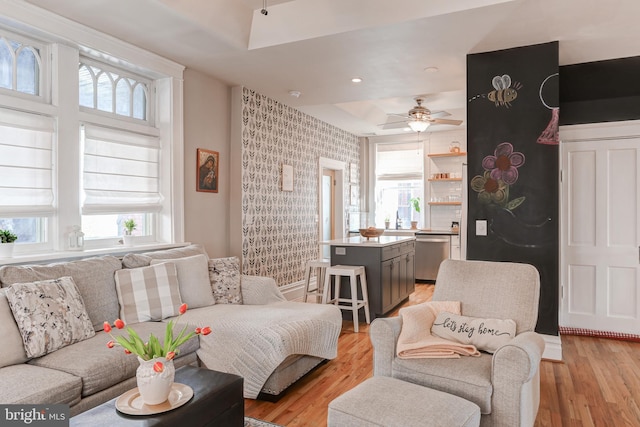 living room with recessed lighting, light wood-style floors, and ceiling fan