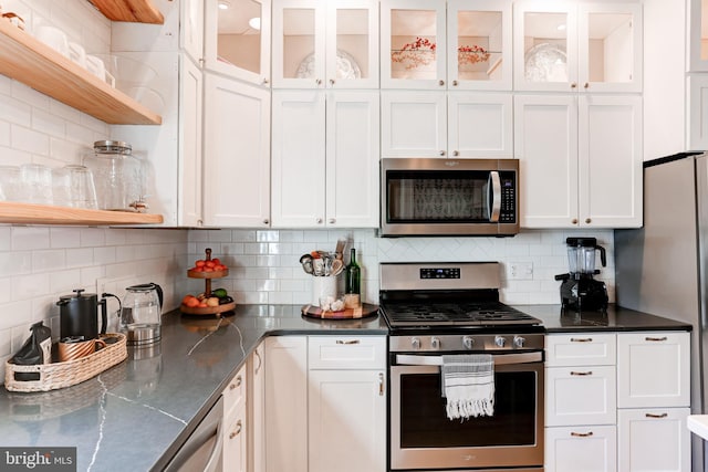 kitchen with open shelves, stainless steel appliances, and white cabinets