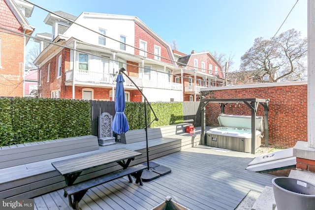 deck with a hot tub