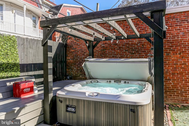 view of patio / terrace with a hot tub