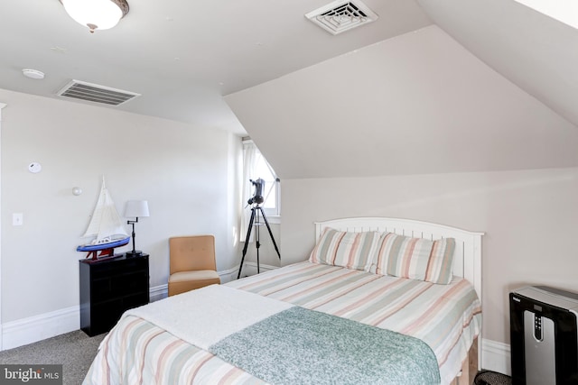 bedroom featuring lofted ceiling, carpet flooring, and visible vents