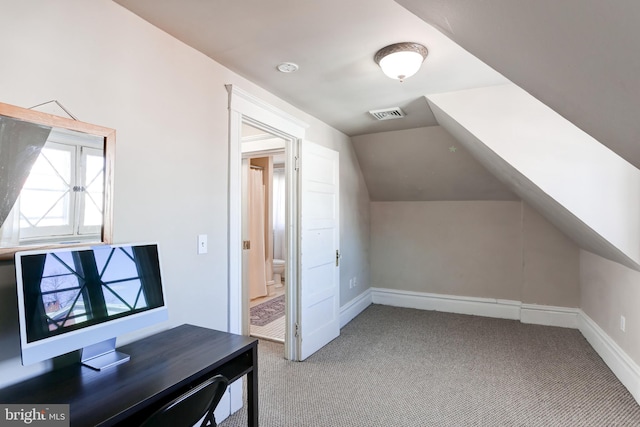 bonus room with lofted ceiling, carpet flooring, visible vents, and baseboards