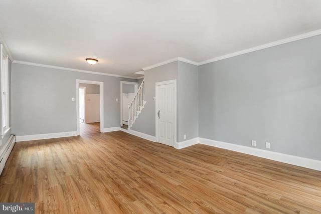 unfurnished room with stairs, crown molding, baseboards, and light wood finished floors