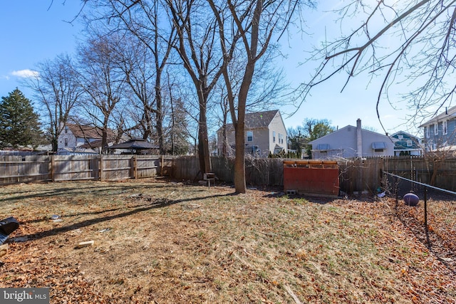 view of yard with a residential view and a fenced backyard