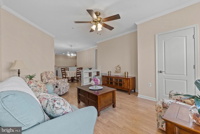 living area with light wood-style flooring, ceiling fan with notable chandelier, crown molding, and baseboards