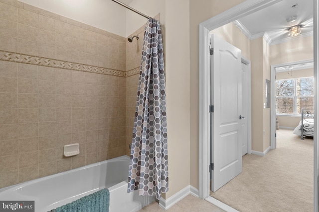 bathroom featuring baseboards, shower / tub combo with curtain, and crown molding