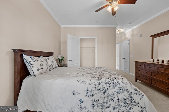 bedroom featuring crown molding, carpet, a closet, and ceiling fan