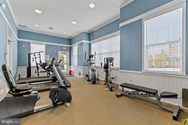 gym featuring visible vents, recessed lighting, carpet, and ornamental molding