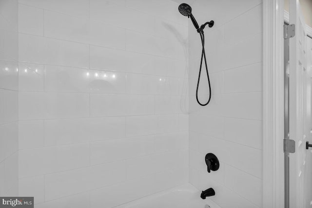 details featuring bathtub / shower combination