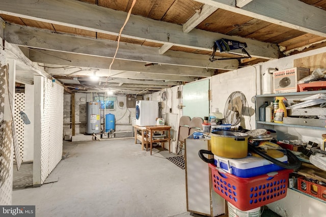 unfinished basement with washer / clothes dryer and water heater