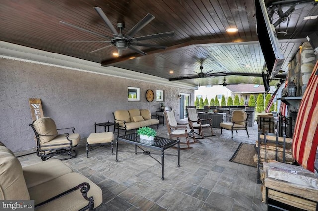 view of patio with an outdoor hangout area, outdoor dry bar, and ceiling fan