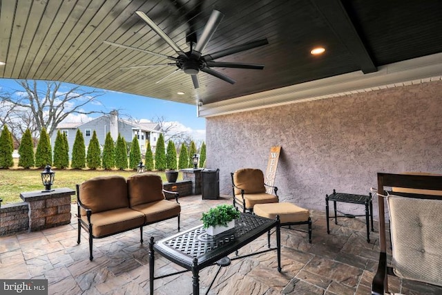 view of patio featuring outdoor lounge area and a ceiling fan