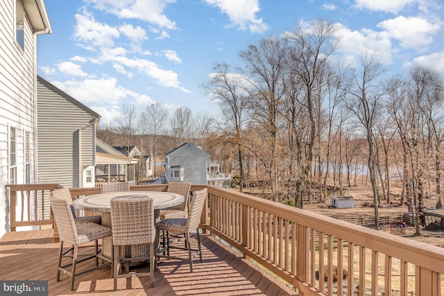 deck with outdoor dining area