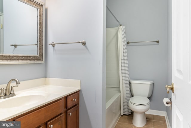 full bathroom featuring tile patterned floors, toilet, shower / bath combo, baseboards, and vanity