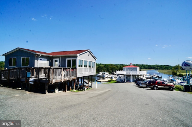 back of house with a water view